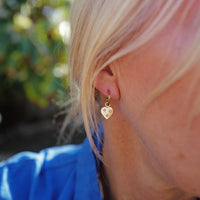 [modelwears Gold Tiny Cupid Hoop Earrings]