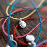 Silver Smiley Face Cord Bracelet