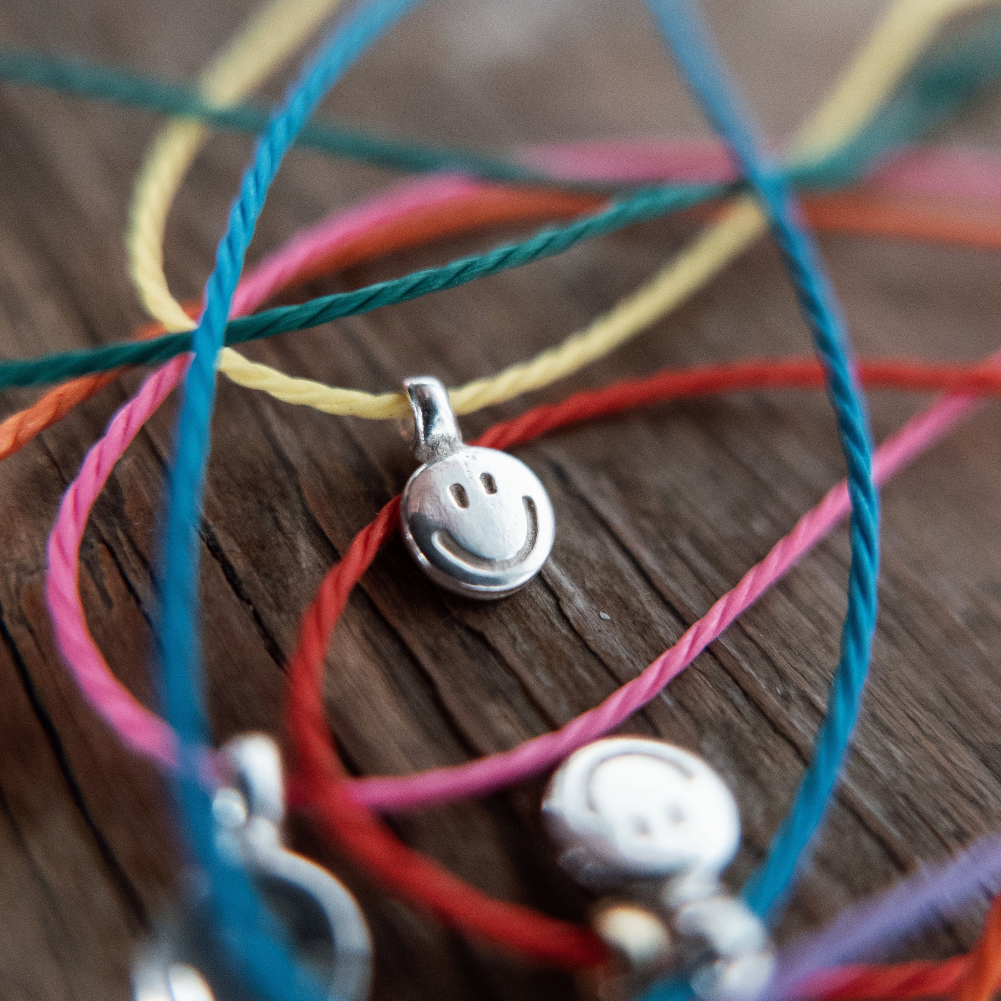 Silver Smiley Face Cord Bracelet