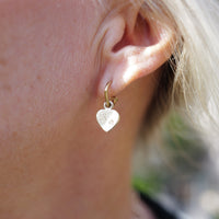 [modelwears Gold Tiny Cupid Hoop Earrings]