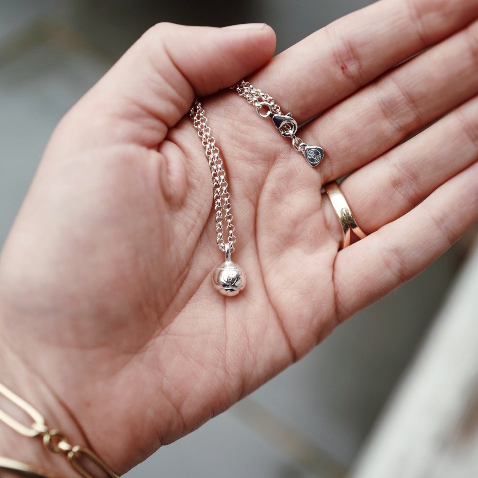Silver DD Tennis Ball Necklace