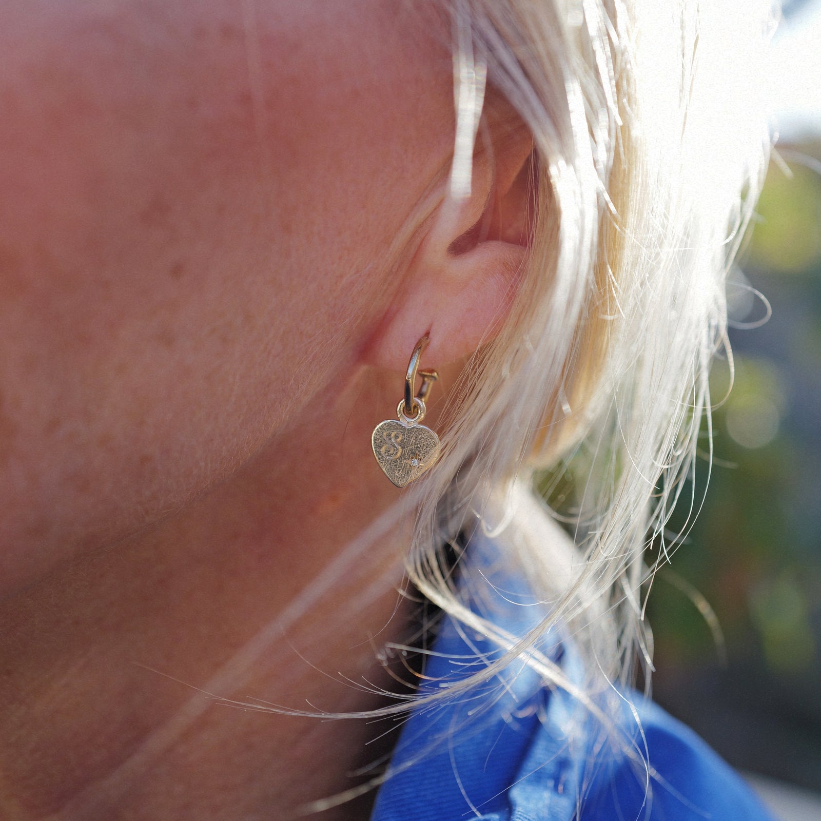 [modelwears Gold Tiny Cupid Hoop Earrings]