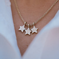 [modelwears Hand Engraved Gold Two Diamond Trio Guiding Star Necklace]