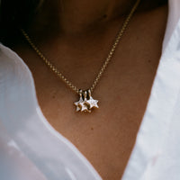 [modelwears Gold Two Diamond Trio Guiding Star Necklace with Hand Engraving]