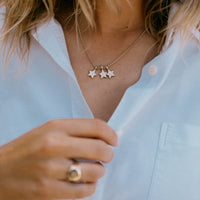 [modelwears Gold Two Diamond Trio Guiding Star Necklace with Hand Engraving]