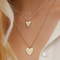 [modelwears Silver & Gold Mini Heart Necklace with Emerald Stone]