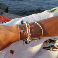 [modelwears Gold Maxi Stack Bangle]
