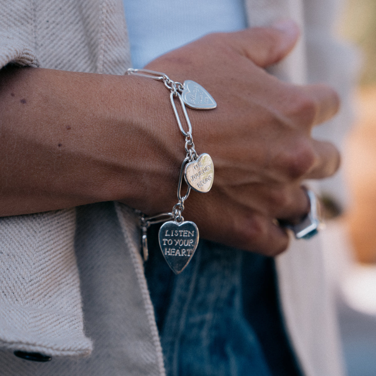 [modelwears Silver Heart Love Token Bracelet] [women]