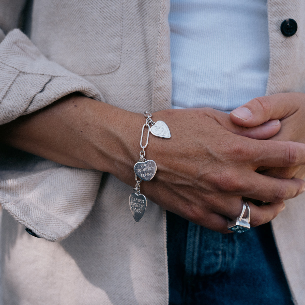 [modelwears Silver Heart Love Token Bracelet] [women-hover]