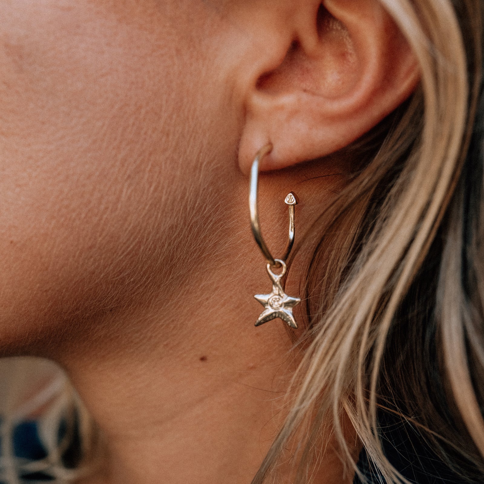 [modelwears Gold Maxi Cupid Hoops with Gold Mini Star Earring Charms]