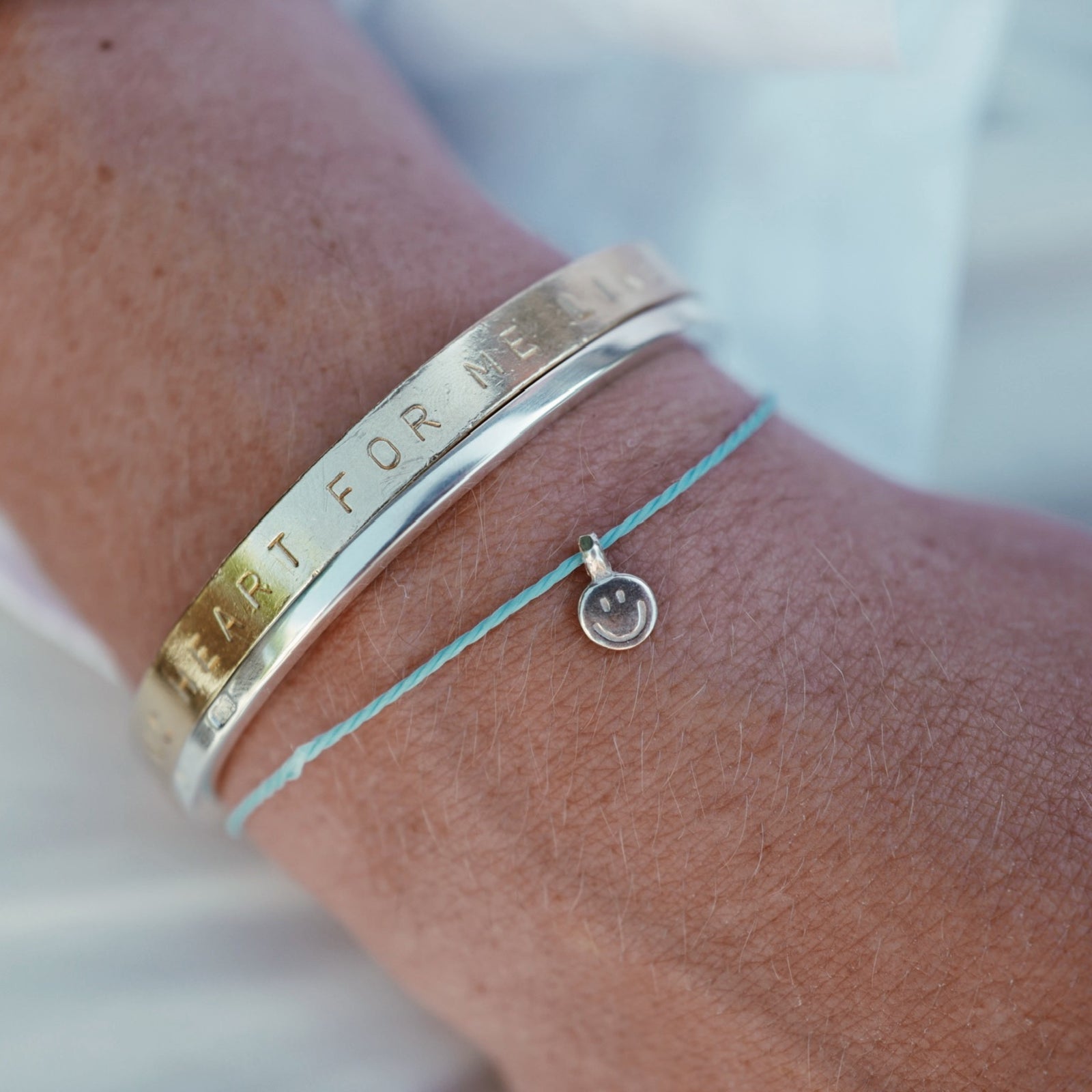 Silver Smiley Face Cord Bracelet