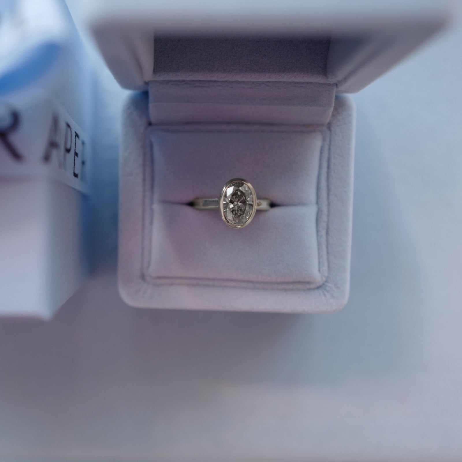 'The Story' Platinum Oval 2ct Lab Grown Diamond Bezel Engagement Ring