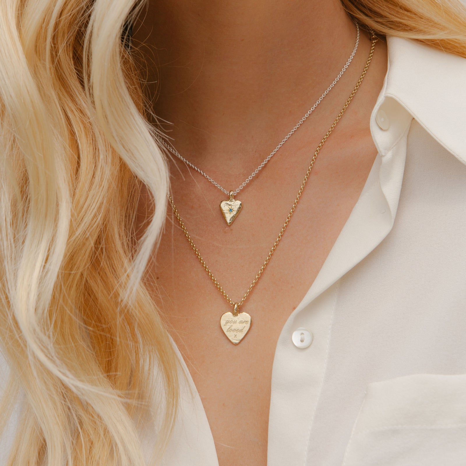 [modelwears Silver & Gold Mini Heart Necklace with Blue Topaz Stone]